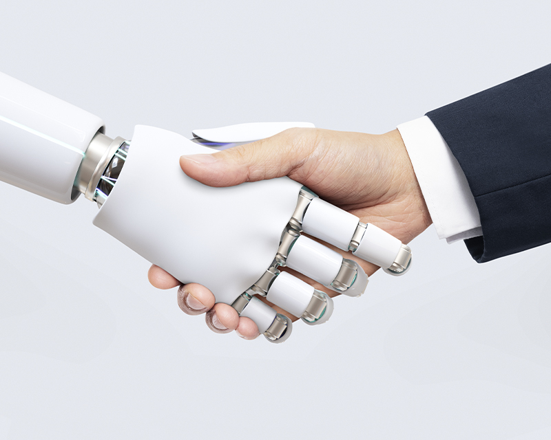 robot hand and human hand greeting