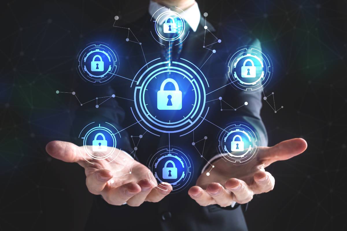 Hands holding digital lock icons with connection lines, representing data protection and cybersecurity.