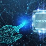 Representation of fintech technology with a digital hand pointing at a processor labeled "Fintech."