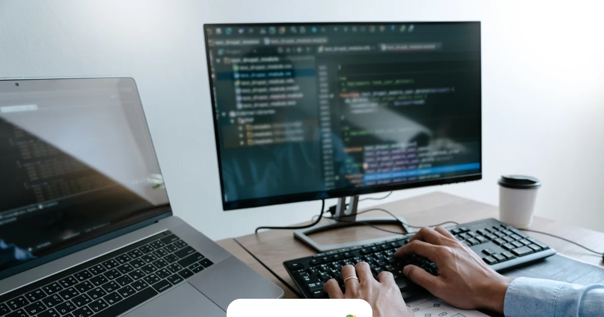 Hands typing in a computer