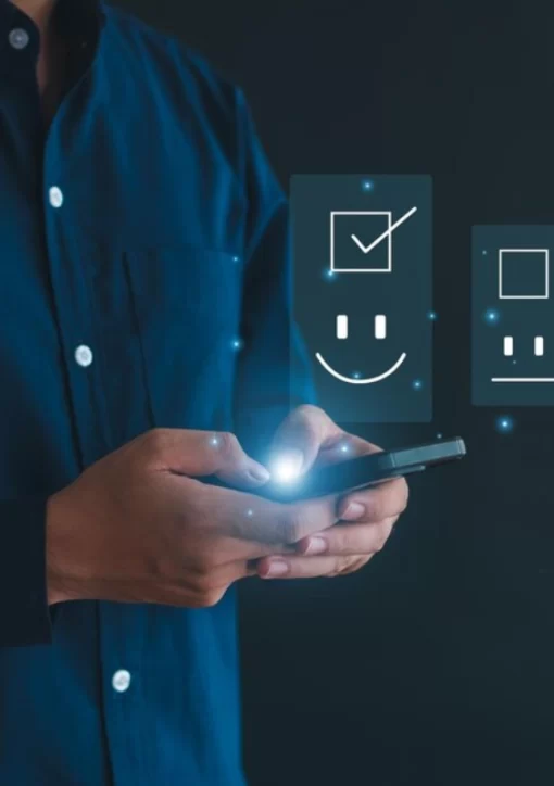 a man with a cellphone showing a happy face representing combing QA with AI.