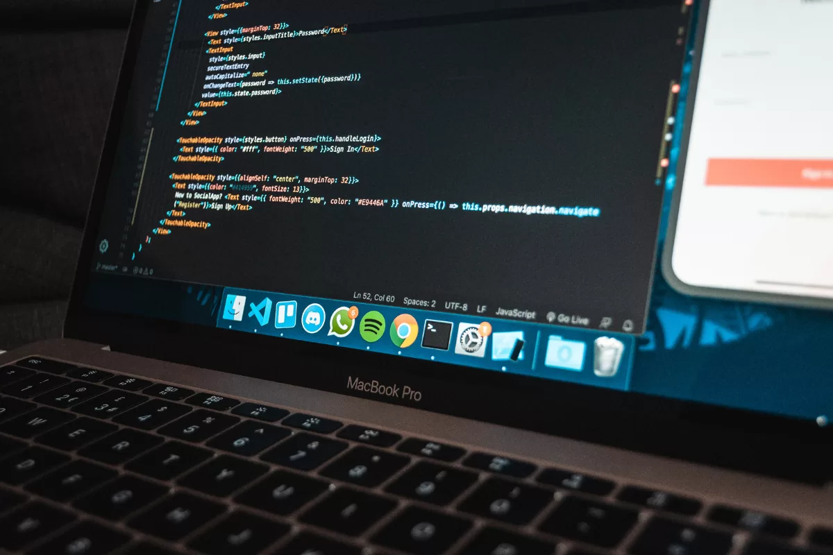 A laptop screen showing codes 