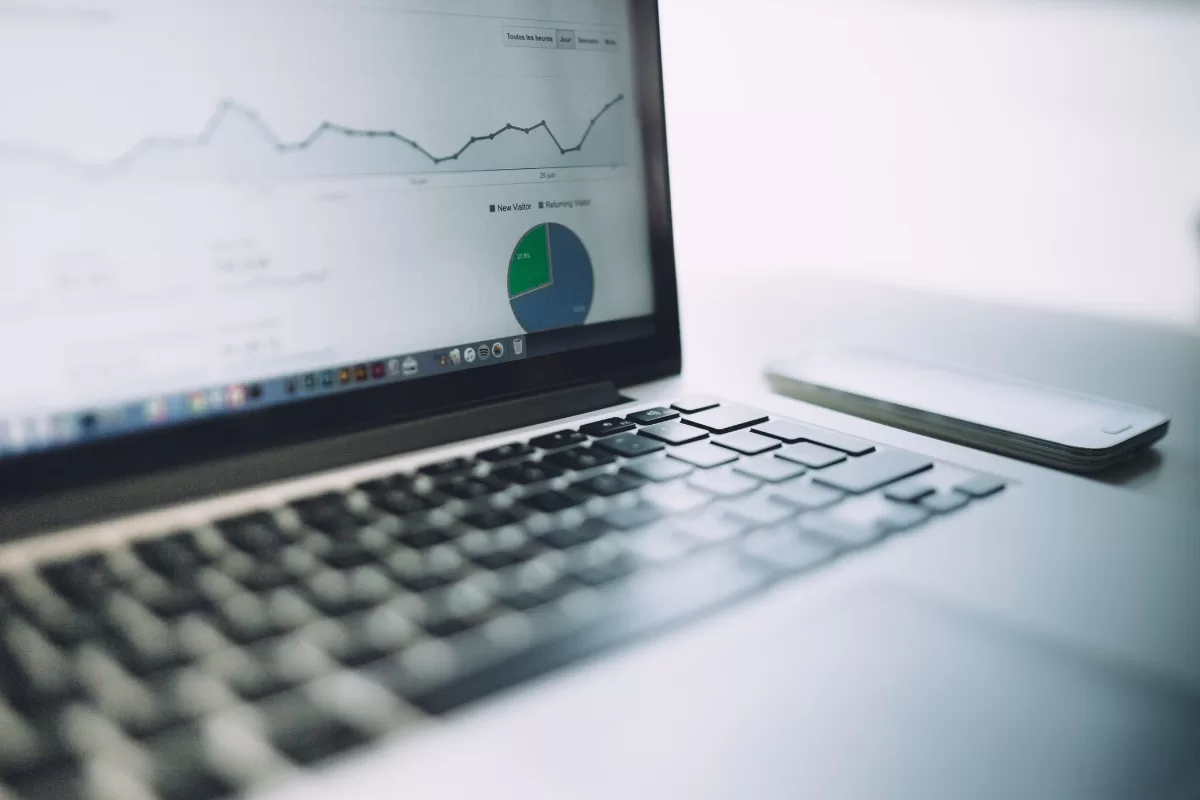 Documents with charts, tables, and planning timelines, symbolizing IT project management and control.