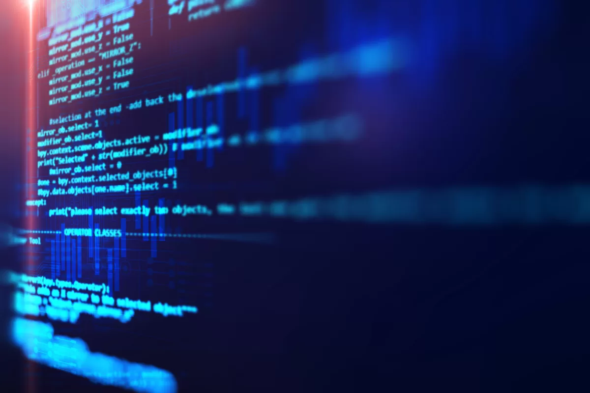 Close-up of computer screen displaying Python programming code with selection commands and conditional structures, illustrating system development and maintenance.