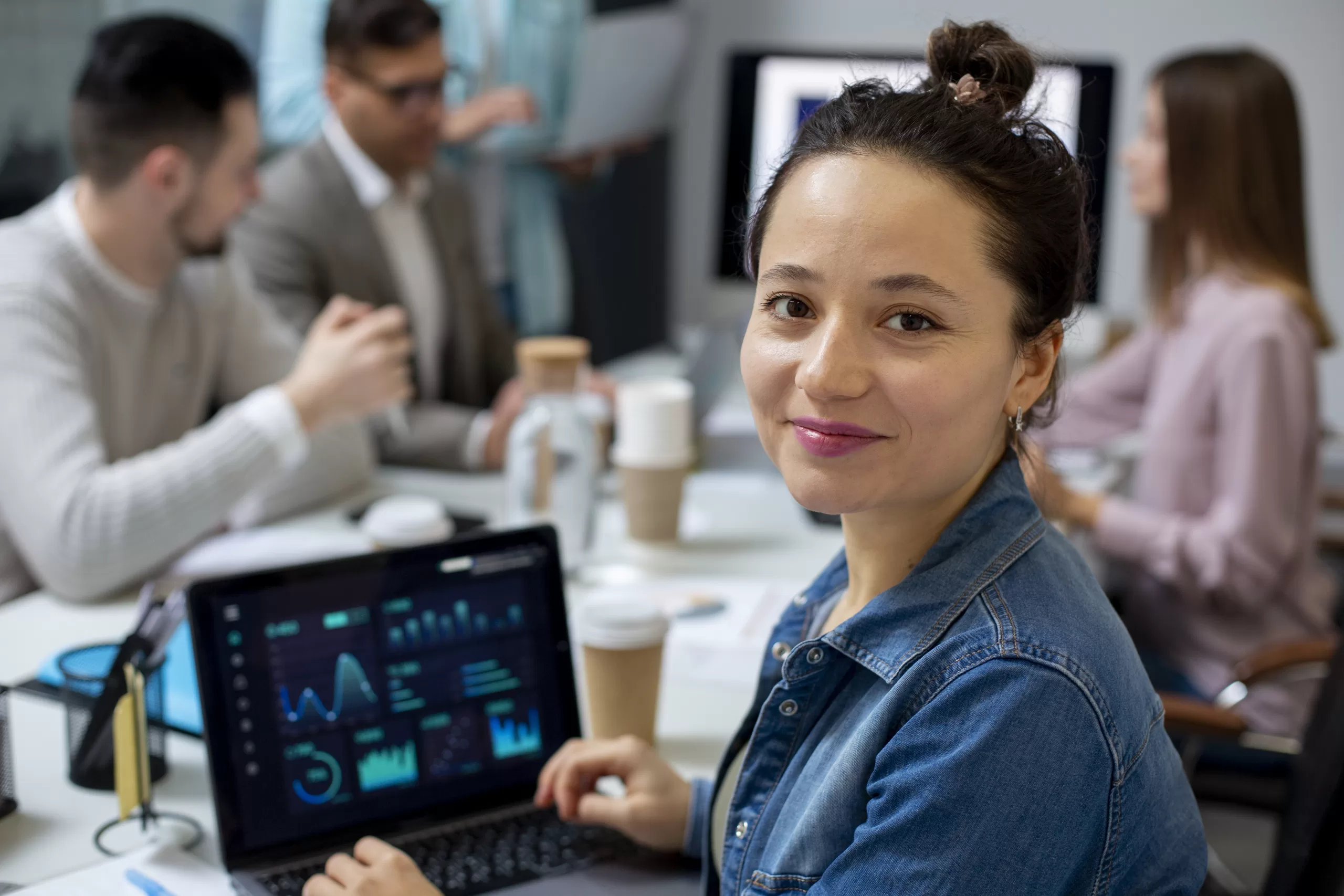 Tech professional analyzing an automated process flow on screen with a digital network overlay