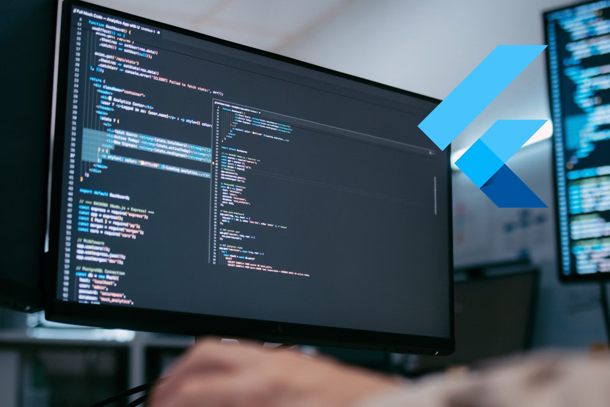 Computer screen displaying dashboard code with the Flutter logo highlighted, representing Flutter for Web development