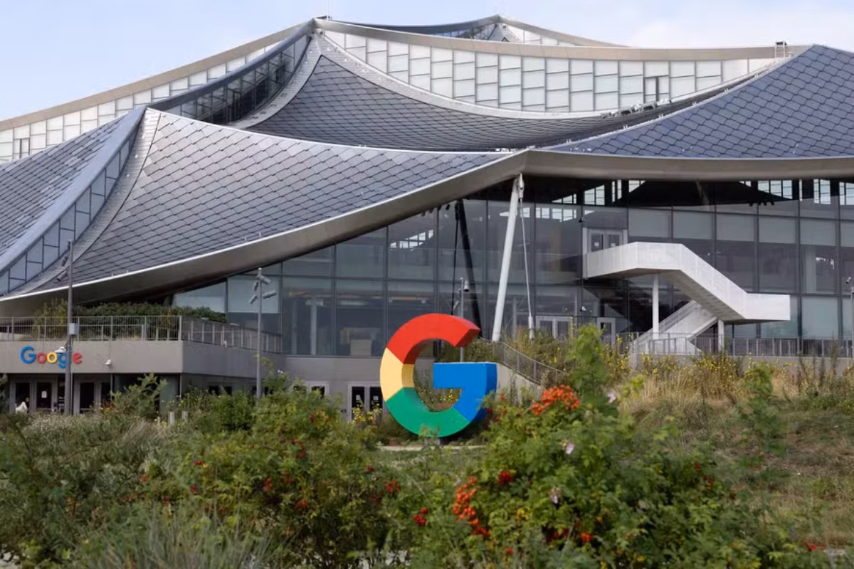Google headquarters, part of Alphabet, with a wavy roof and a colorful “G” logo in front